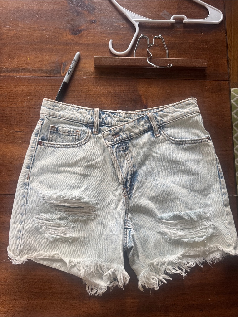 Light Wash Distressed Women’s Denim Asymmetrical Waistline Shorts